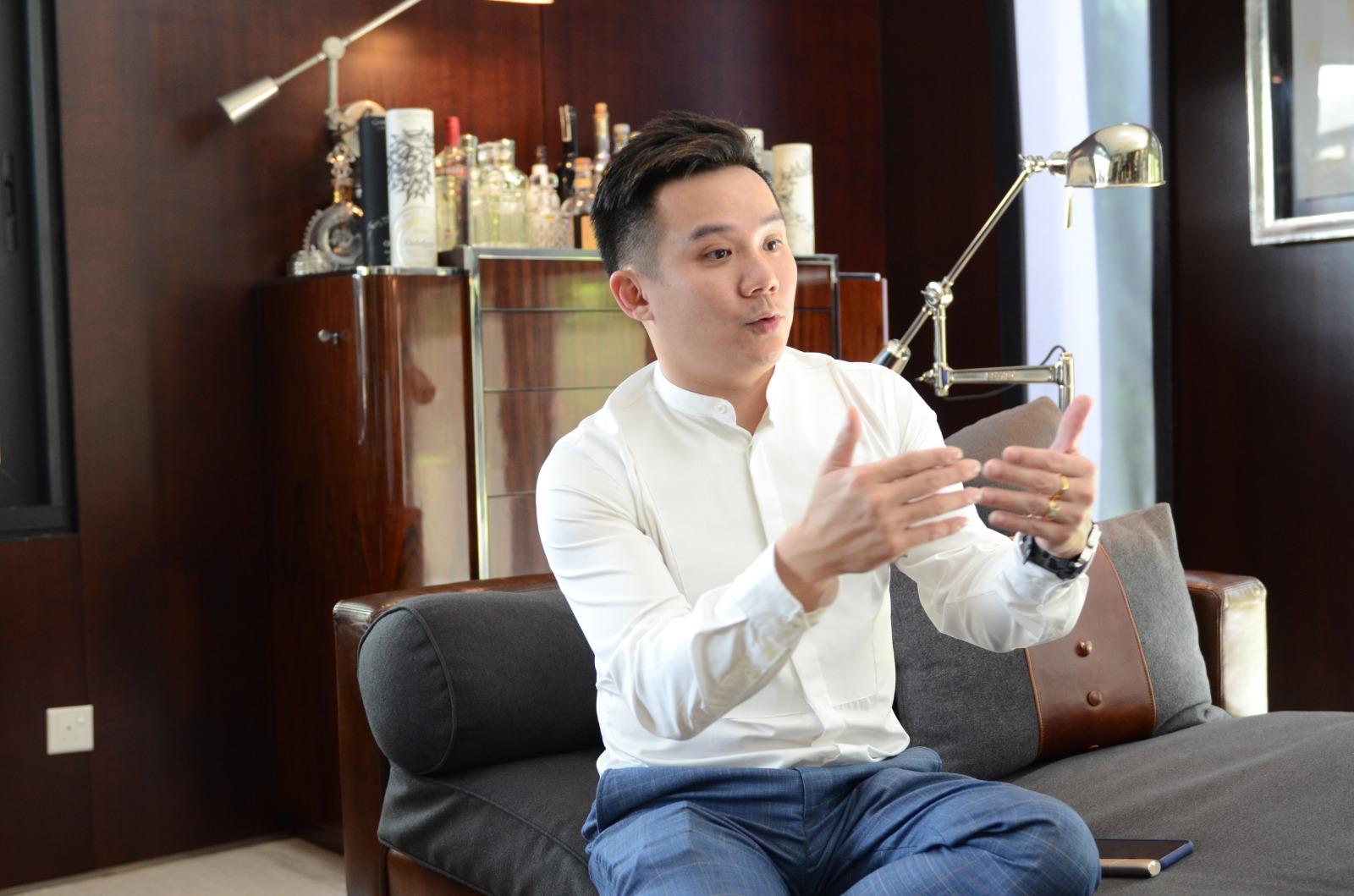 Alvin Choo in conversation, discussing property strategy.