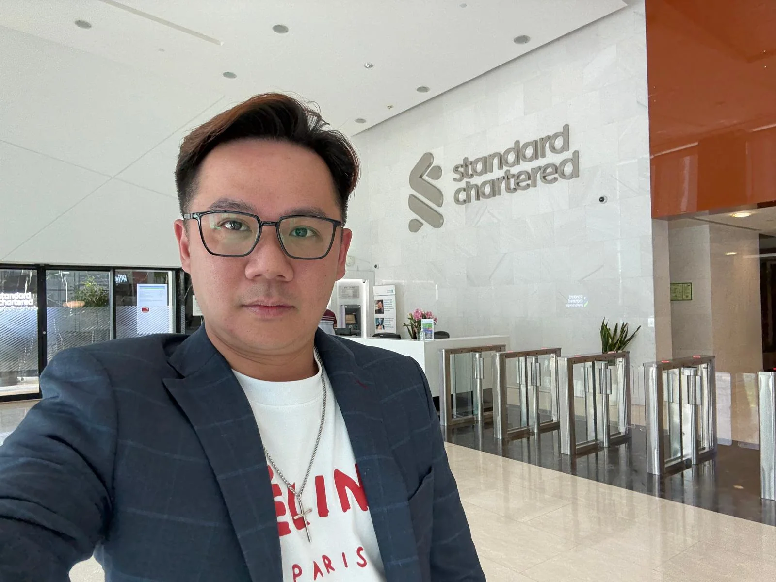 Alvin Choo at a banking office during transaction preparation