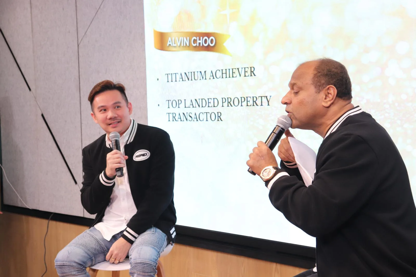 Alvin Choo speaking on stage at a property industry event